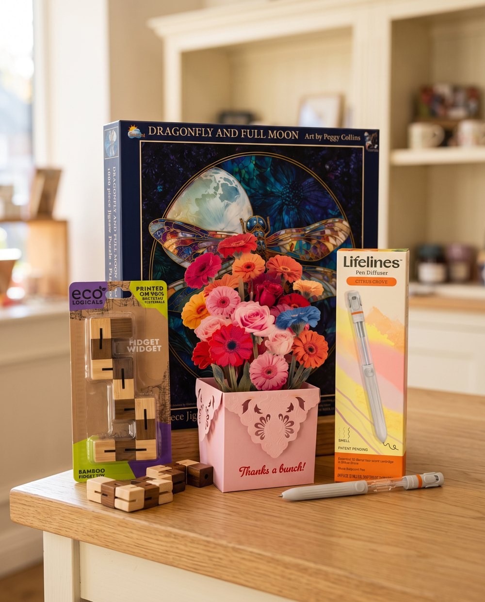 From the November issue: SunsOut Dragonfly and Full Moon puzzle, Pictura Gerber Daisies pop-up card, Lifelines Citrus Grove pen diffuser and Project Genius Fidget Widget